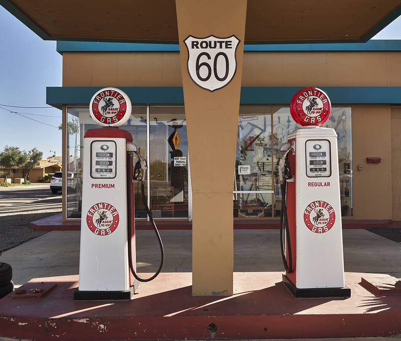 Vintage Frontier Gasoline pumps in Wickenburg, a small Arizona city northwest of Phoenix that was once a "rough and ready" western frontier town that still spotlights Old West scenes and dress and art and refers to its location as "out Wickenburg Way"