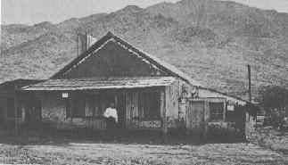 Charles P. "Chuck" Stanton standing in front of his home/store in Stanton, Arizona, sometime before his death in 1886.